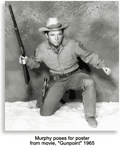 Audie Murphy posing for movie poster