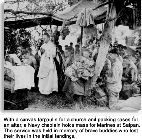 Chaplain leading prayer in tent