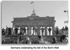 Germans dance on the Berlin Wall