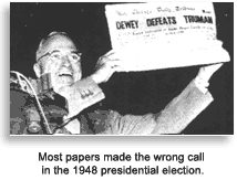 Truman displaying post election newspaper, 1948